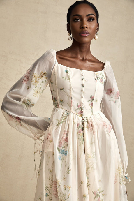 A floral print midi dress with a square neckline named Anne featuring a colorful floral pattern on a light background