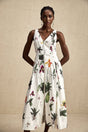 A floral print midi dress with a vneck and poplin fabric featuring a colorful Magali design on a light background