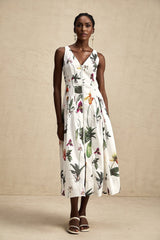 A floral print midi dress with a vneck and poplin fabric featuring a colorful Magali design