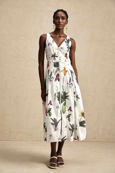 A floral print midi dress with a vneck and poplin fabric featuring a colorful Magali design