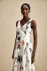A floral print midi dress with a vneck made from poplin fabric featuring a vibrant pattern named Magali