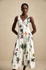 A floral print midi dress with a vneck made from poplin fabric featuring the Magali design