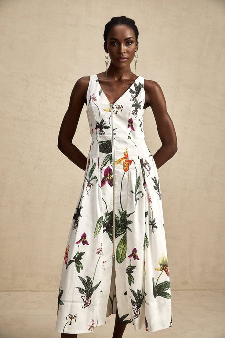 A floral print midi dress with a vneck made from poplin fabric featuring the Magali design