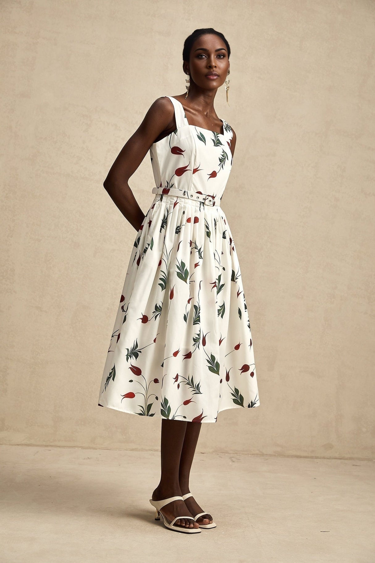 A floral print midi dress with a white background and colorful flower pattern made from poplin fabric featuring a feminine silhouette and called Laetitia