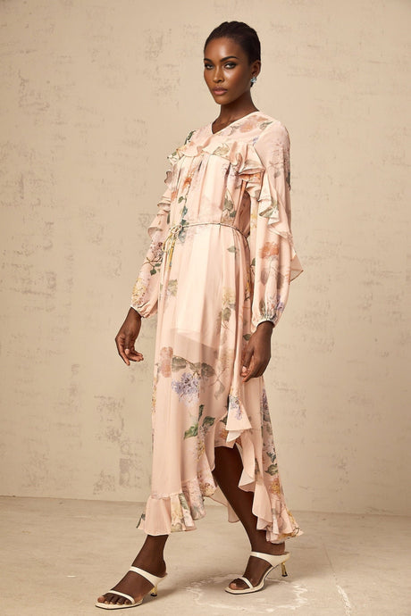 A floral print midi dress with ruffled trim called Patricia featuring a feminine silhouette and colorful flower pattern