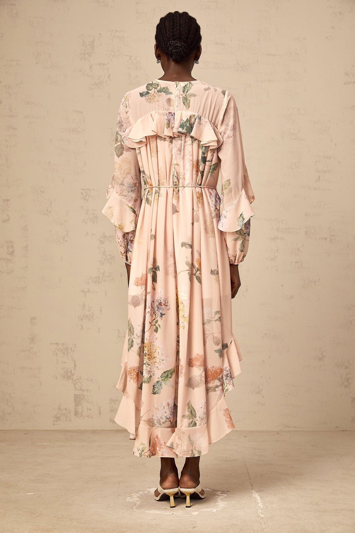 A floral print midi dress with ruffled trim named Patricia featuring a feminine silhouette and delicate pattern