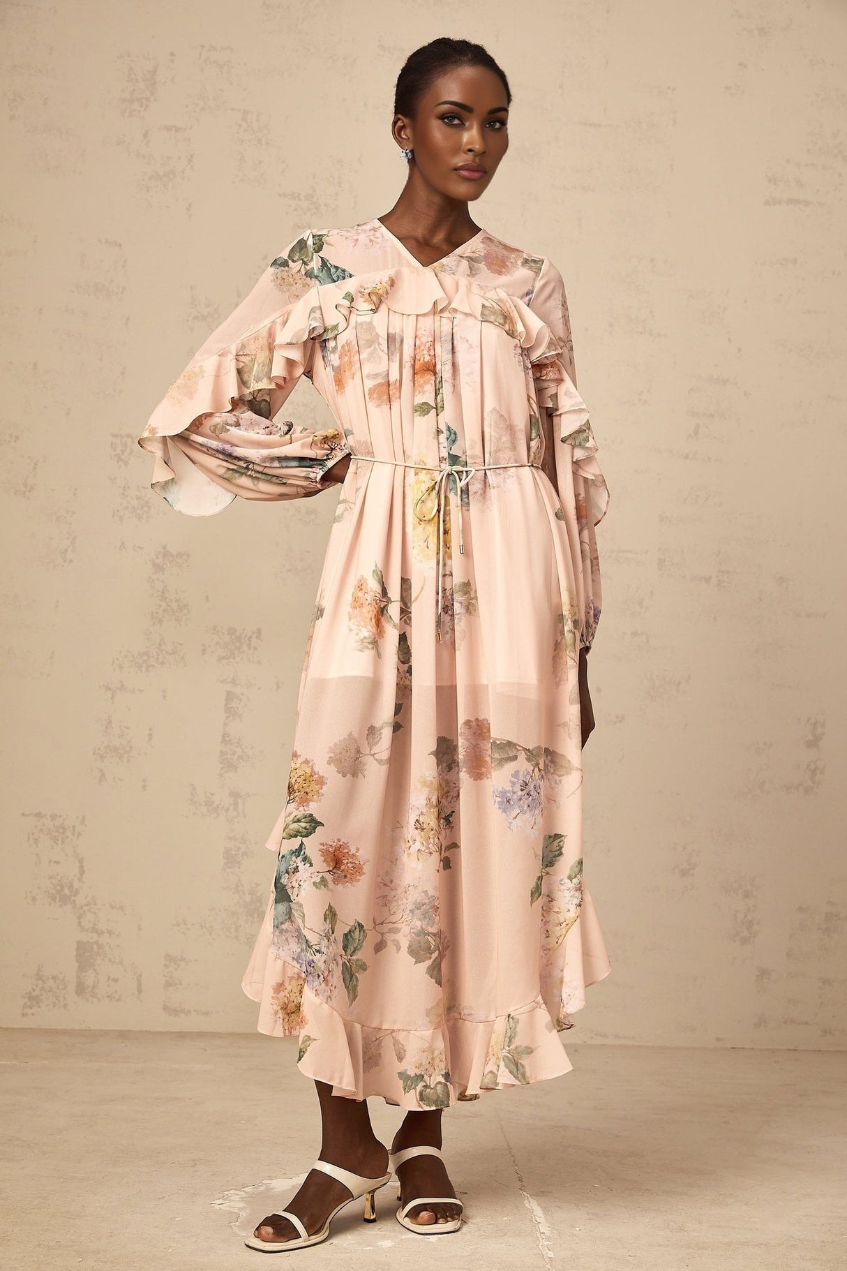 A floral print midi dress with ruffled trim named Patricia featuring a feminine silhouette and vibrant pattern