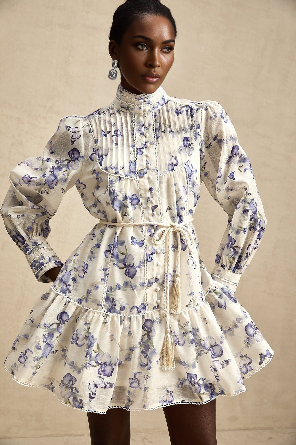 A floral print mini dress with a flared skirt made from chiffon fabric The dress features a vibrant floral pattern and has a short length with a flowy silhouette