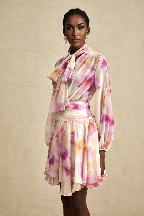A floral print mini dress with a Vneck design featuring the Maelys brand