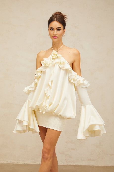 A floral print mini dress with cold shoulder design and ruffled details featuring a vibrant fleur pattern