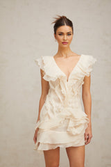 A floral print mini dress with layered ruffles and a faux flower design featuring a short hemline and feminine silhouette