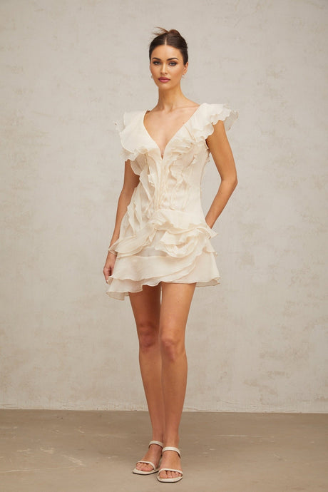 A floral print mini dress with layered ruffles and a faux flower design