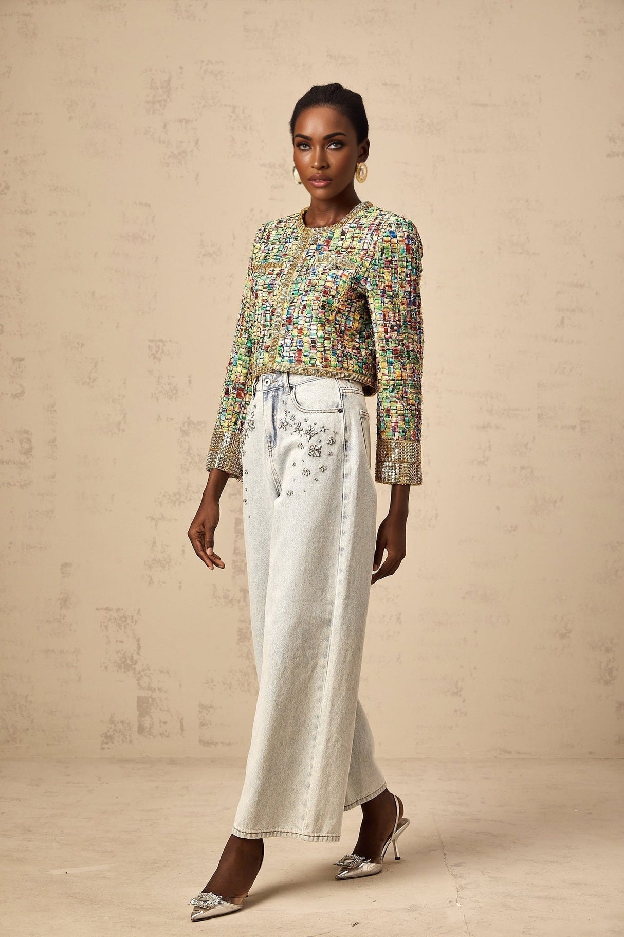 A gold sequined tweed jacket with a checked pattern showcasing a luxurious and sparkly appearance