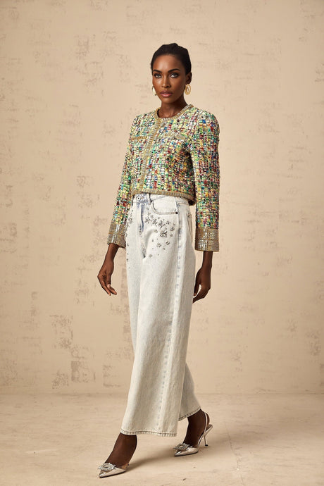 A gold sequined tweed jacket with a checked pattern showcasing a luxurious and sparkly appearance