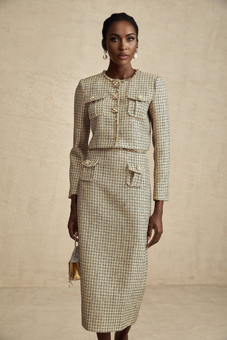 A gold tweed jacket and matching skirt set adorned with sequins for a sparkly elegant look