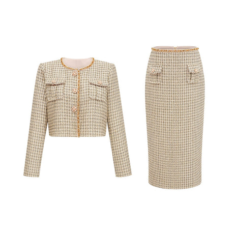 A gold tweed jacket and matching skirt set with sequin embellishments The outfit features a tailored jacket and a coordinating skirt both made from shimmering gold tweed fabric adorned with sparkling sequins