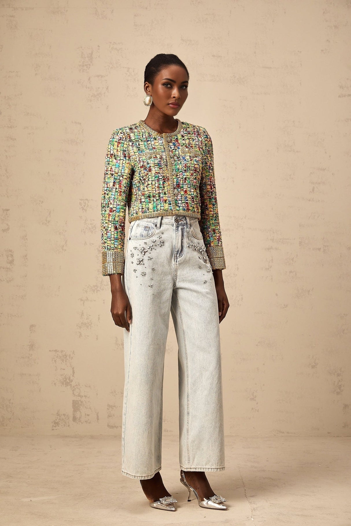 A goldtoned tweed jacket with a checked pattern and sequin embellishments