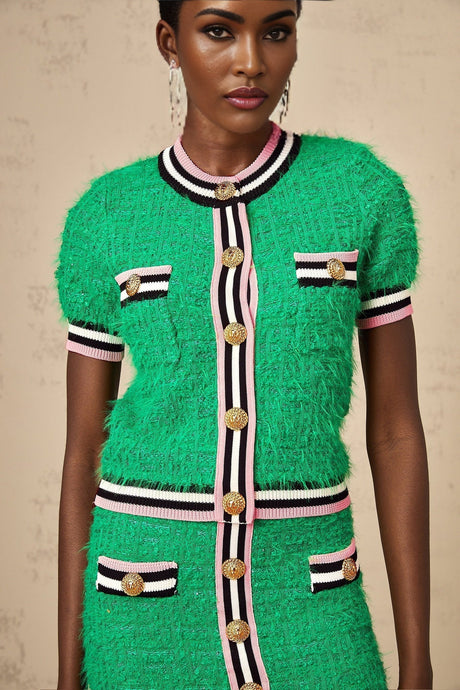 A green knitted two piece outfit consisting of a top and skirt in a matching set called Camille