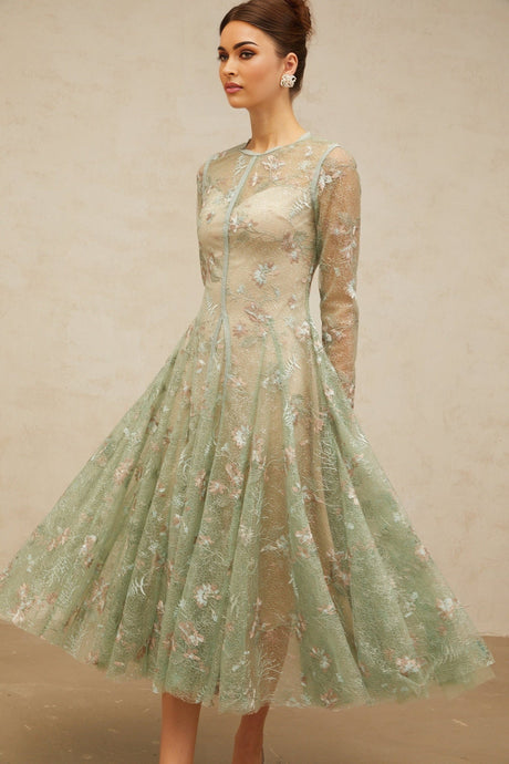 A green pleated midi dress with floral embroidery details named Philomene