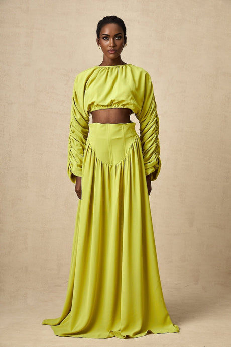 A green twopiece outfit consisting of a smocked top and matching skirt for women called Émilie set