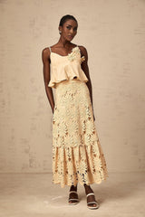 A khaki colored matching set consisting of a cutout flared top and skirt by Celine