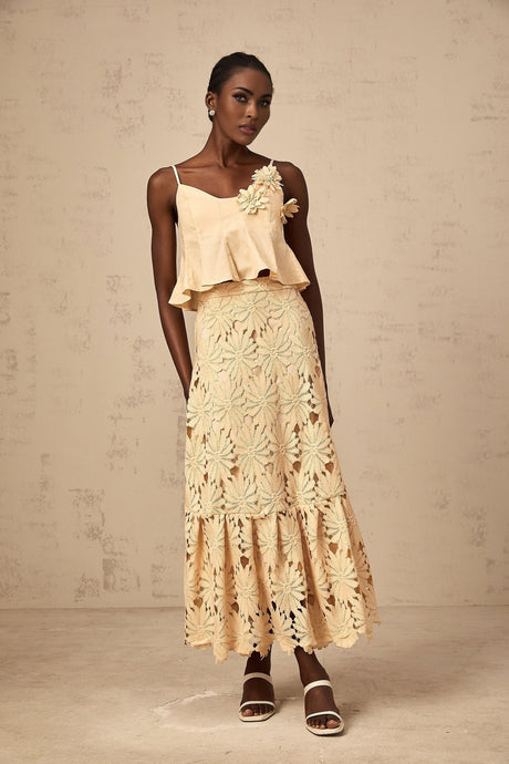 A khaki colored matching set consisting of a cutout flared top and skirt by Celine