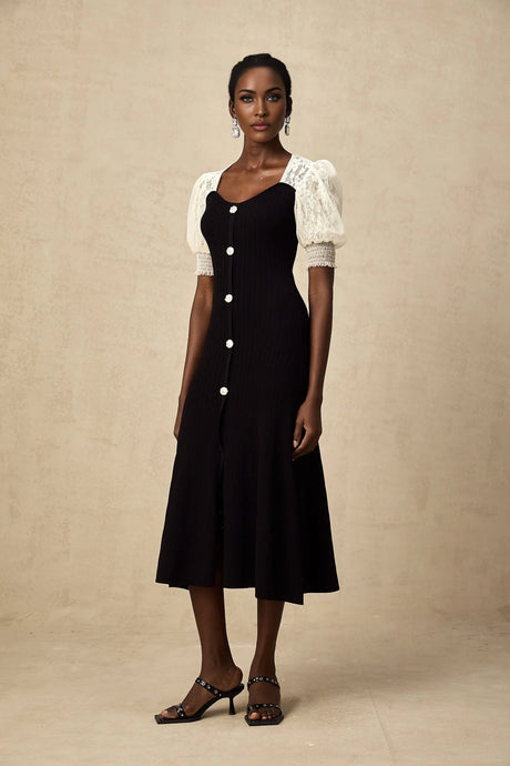 A knit midi dress with lace trim detailing named Noa