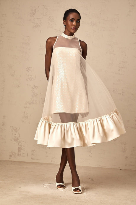 A layered midi dress with a tulle panel and sequin embellishments named Josette featuring a combination of shimmering fabric and delicate sheer overlay