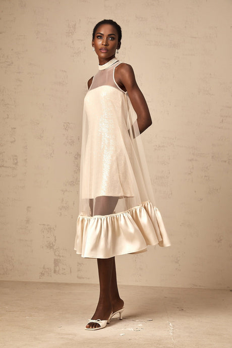 A layered midi dress with a tulle panel and sequin embellishments named Josette featuring a combination of shimmering fabric and delicate tulle overlay