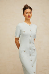A light blue knitted midi dress with a pencil silhouette fitted design and sleek profile