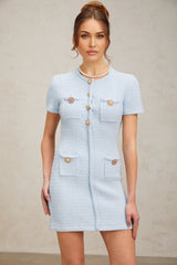 A light blue knitted mini dress with crystal embellishments and a fitted silhouette named Cindy