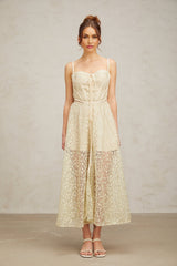 A light green midi dress with floral embroidery details named Yasmine