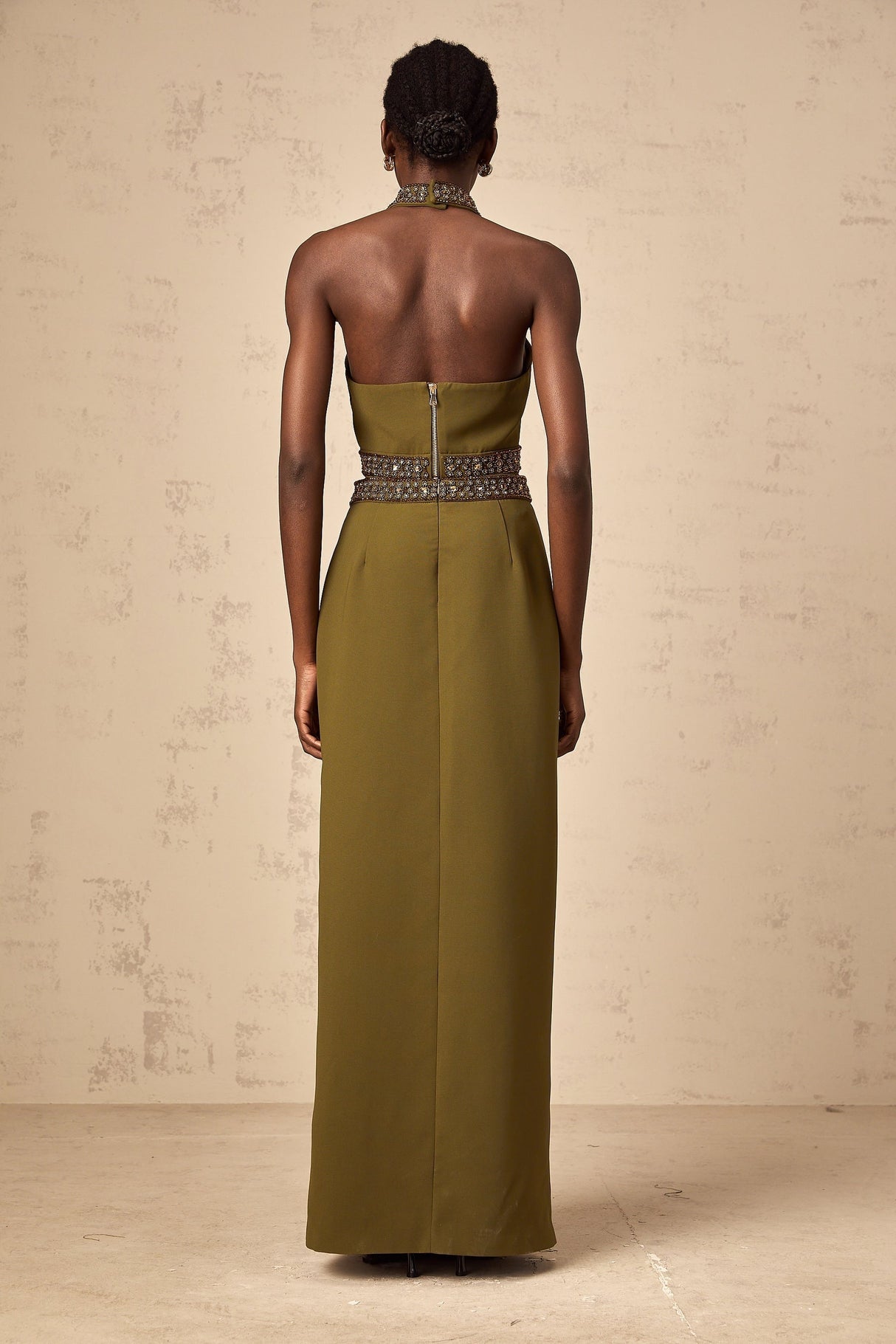 A light green top and skirt set with daisy floral beaded trim details along the edges creating a matching outfit ensemble