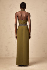 A light green top and skirt set with daisy floral beaded trim details along the edges creating a matching outfit ensemble