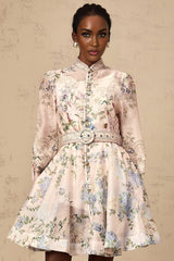 A light pink mini dress with a floral print pattern covering the fabric