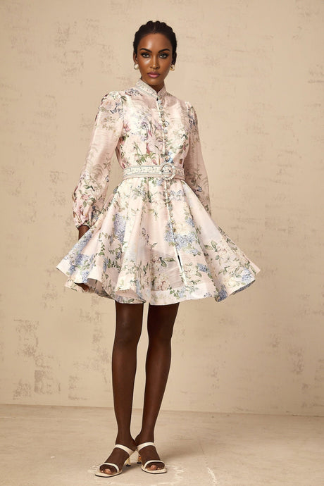 A light pink mini dress with a floral print pattern covering the fabric