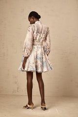 A light pink mini dress with a floral print pattern covering the fabric