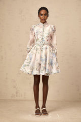 A light pink mini dress with a floral print pattern featuring short sleeves and a fitted silhouette