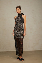 A long black halterneck maxi dress with floral lace detailing named Coralie