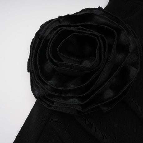 A long black hooded maxi dress with floral applique detailing named Axelle