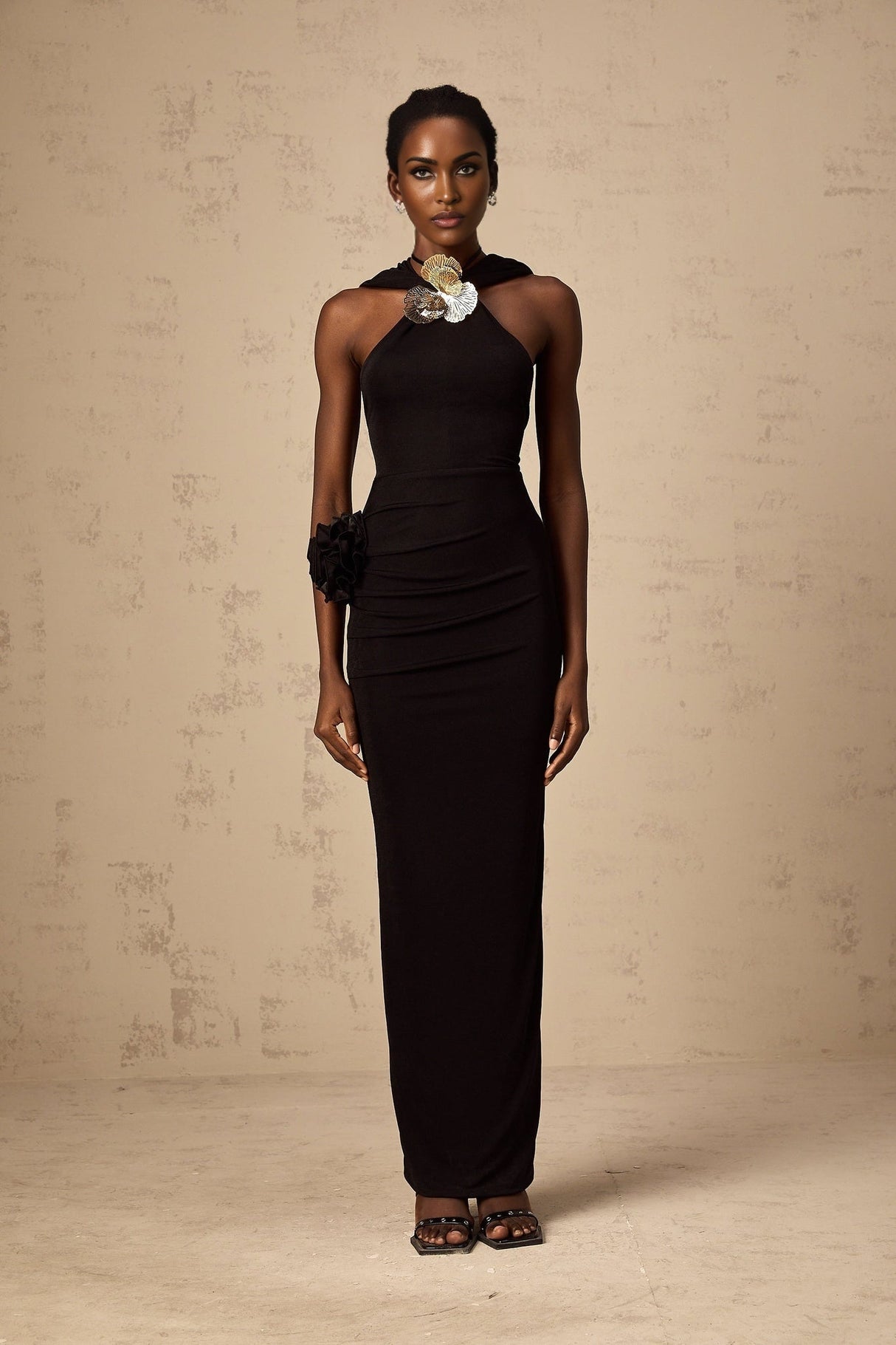 A long black hooded maxi dress with floral applique details named Axelle