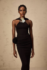 A long black hooded maxi dress with floral applique details on the fabric