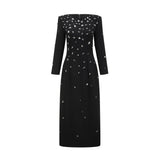 A long black maxi dress adorned with sparkling crystal embellishments