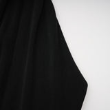 A long black maxi dress with a hood featuring floral applique details