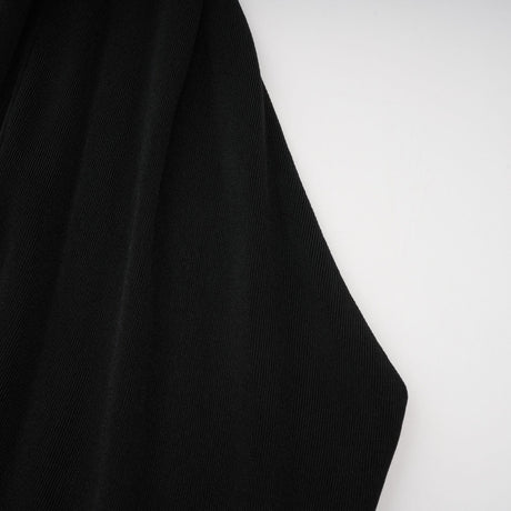 A long black maxi dress with a hood featuring floral applique details