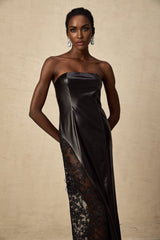 A long black maxi dress with faux leather fabric and lace panel details