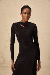 A long black maxi dress with ruched mesh fabric and rhinestone embellishments