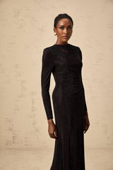 A long black maxi dress with ruched mesh fabric and rhinestone embellishments