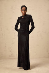 A long black maxi dress with ruched mesh fabric and rhinestone embellishments