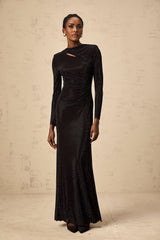 A long black maxi dress with ruched mesh fabric and rhinestone embellishments